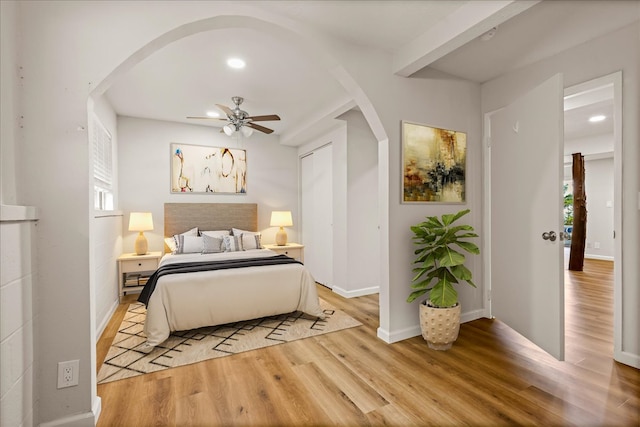 bedroom featuring light hardwood / wood-style flooring and ceiling fan