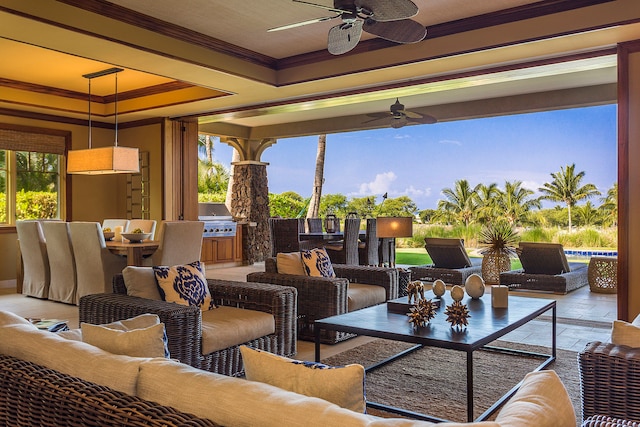 view of patio featuring ceiling fan, an outdoor hangout area, and exterior kitchen