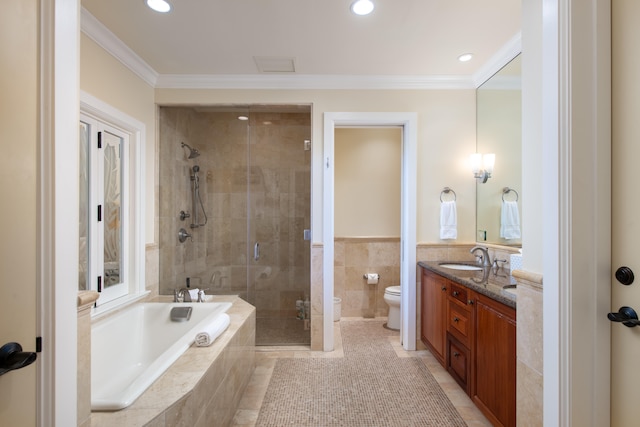 full bathroom with vanity, shower with separate bathtub, toilet, and crown molding