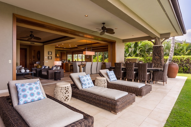 view of patio with ceiling fan and an outdoor living space