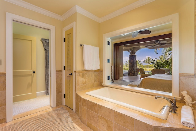 bathroom with a relaxing tiled tub and ornamental molding