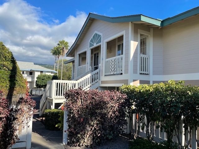 view of side of property featuring a porch