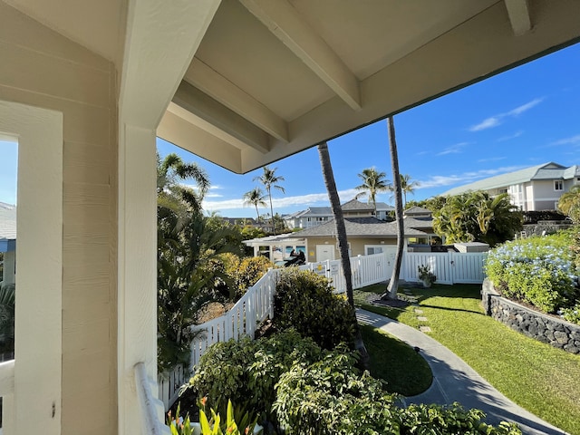 exterior space with vaulted ceiling with beams