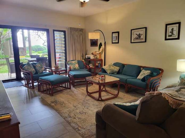 tiled living room with ceiling fan