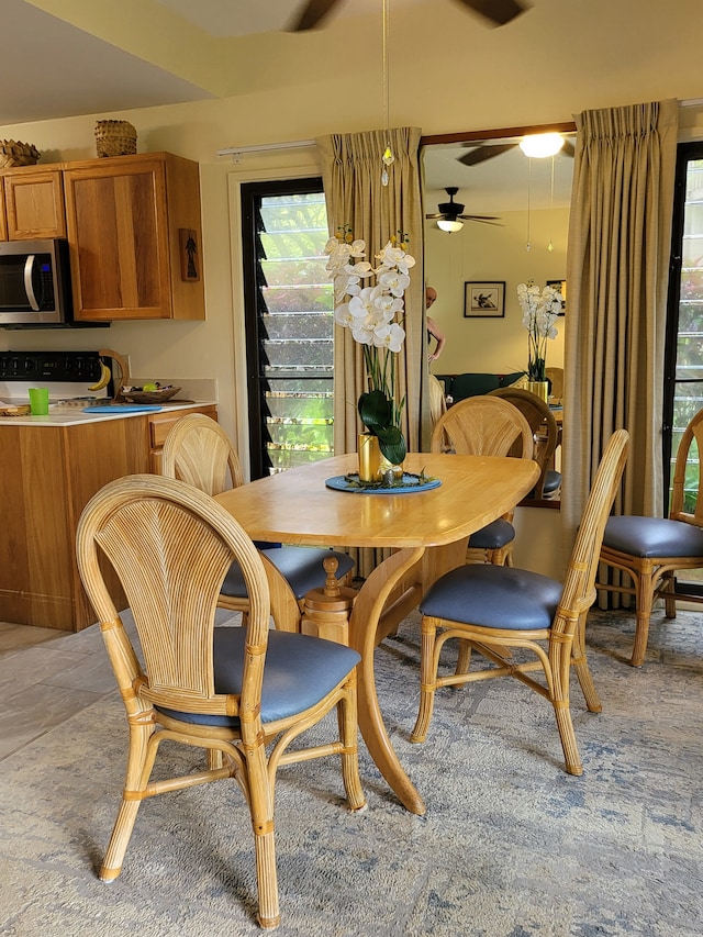 dining room featuring ceiling fan