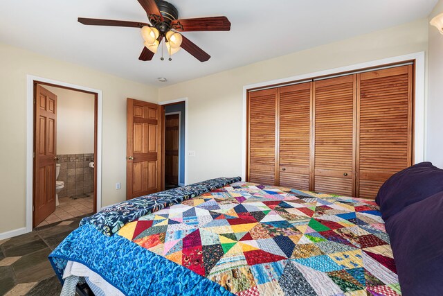 bedroom with a closet, ensuite bath, and ceiling fan