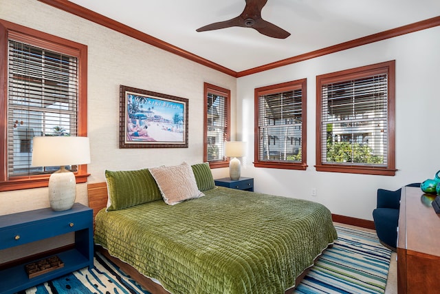 bedroom with ceiling fan and ornamental molding