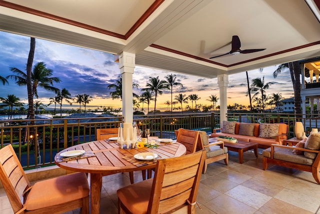 sunroom featuring ceiling fan