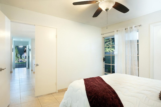 bedroom featuring ceiling fan and light tile patterned flooring