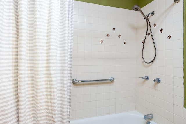 bathroom featuring shower / bath combo with shower curtain