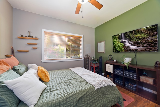 bedroom featuring dark hardwood / wood-style floors and ceiling fan