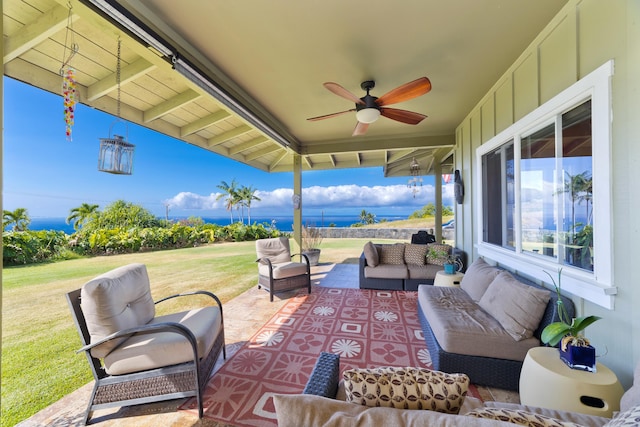 view of patio with an outdoor living space and ceiling fan