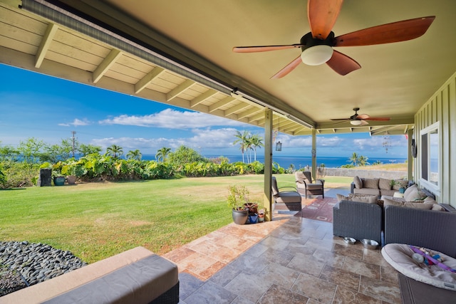 view of patio / terrace with outdoor lounge area, a water view, and ceiling fan