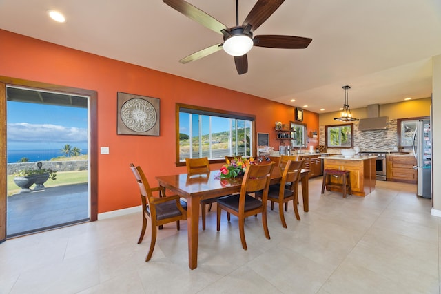 dining space with ceiling fan