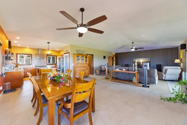 dining room featuring vaulted ceiling and ceiling fan