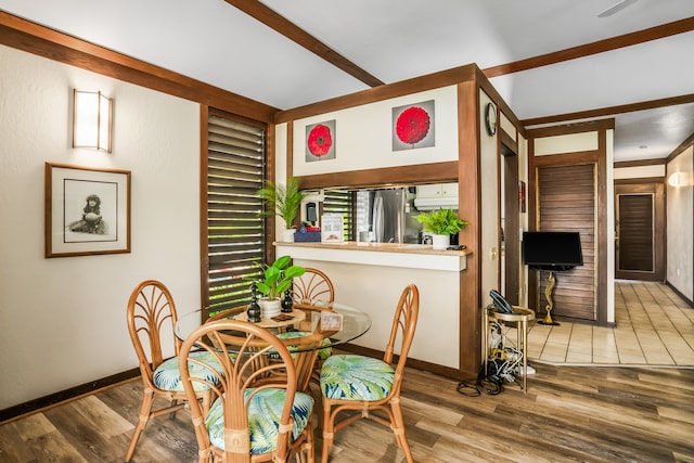 dining space featuring wood-type flooring