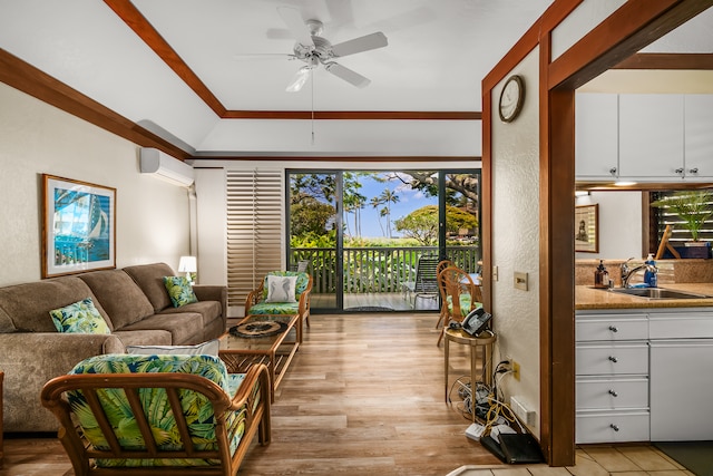 living room with a wall mounted air conditioner, light wood-type flooring, ornamental molding, ceiling fan, and sink