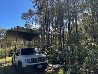 view of vehicle parking featuring a carport