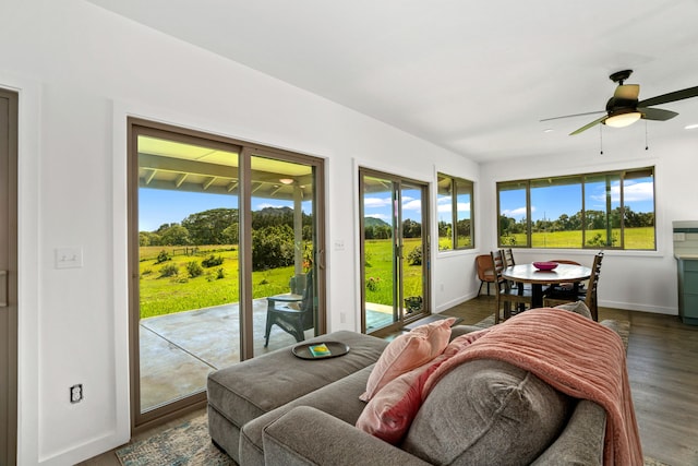 sunroom with plenty of natural light and ceiling fan