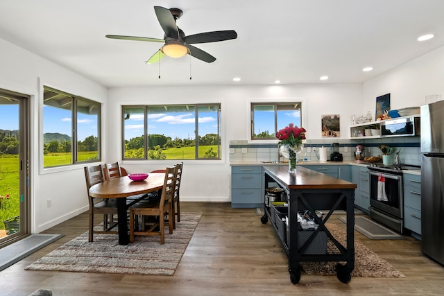 interior space with ceiling fan and dark wood-type flooring