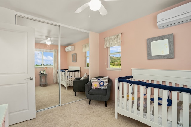 bedroom featuring multiple windows, a wall unit AC, and ceiling fan