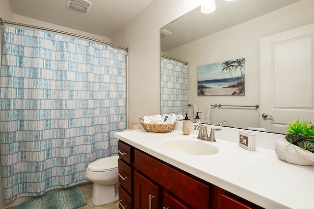 bathroom featuring tile patterned floors, vanity, and toilet