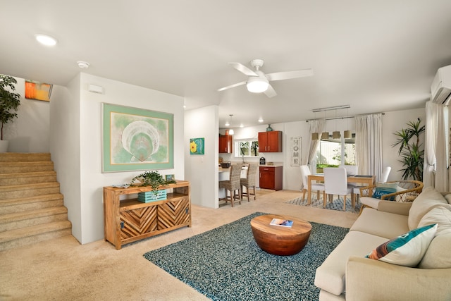 carpeted living room with ceiling fan