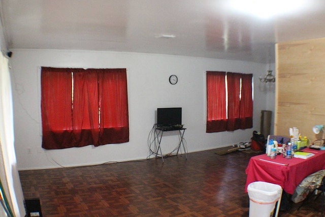 interior space featuring dark parquet flooring