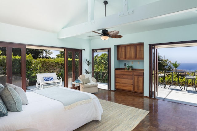 bedroom featuring dark parquet floors, ceiling fan, access to exterior, and high vaulted ceiling