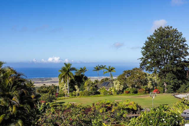 surrounding community featuring a yard and a water view