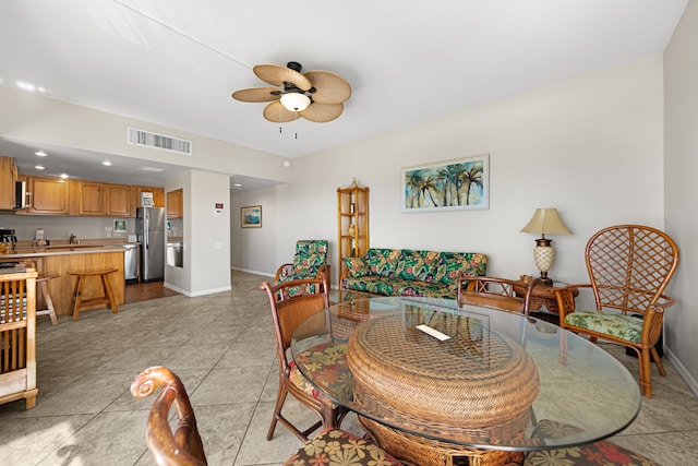 dining room featuring ceiling fan and light tile patterned flooring