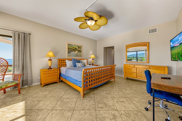 bedroom with ceiling fan and light tile patterned flooring