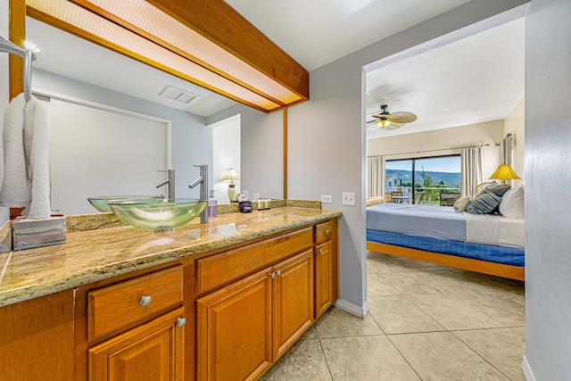 bathroom with vanity, tile patterned floors, and ceiling fan