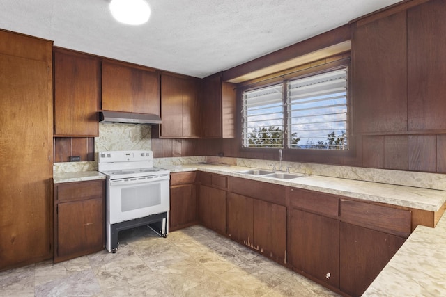 kitchen with sink, a textured ceiling, white electric range oven, and tasteful backsplash