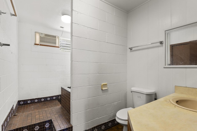 bathroom featuring toilet, tile patterned flooring, a wall mounted AC, and vanity