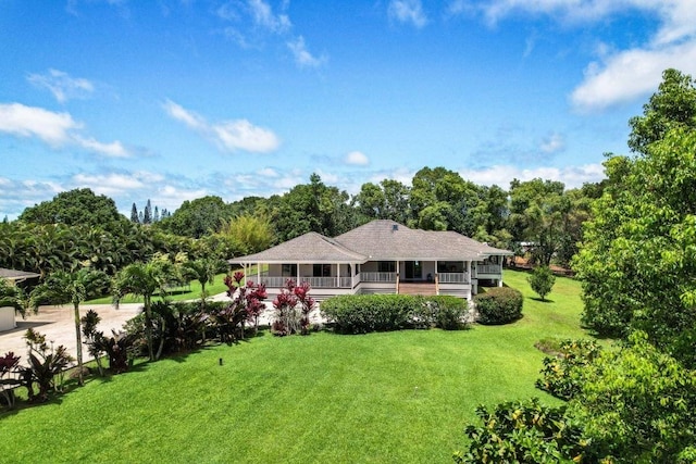 ranch-style home with a front lawn