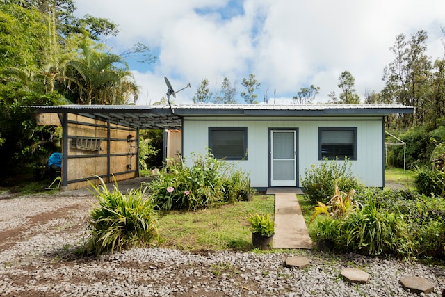 view of front of home with a carport