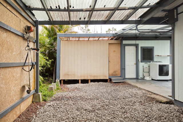 exterior space with washer and clothes dryer