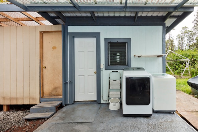 doorway to property with washer and clothes dryer