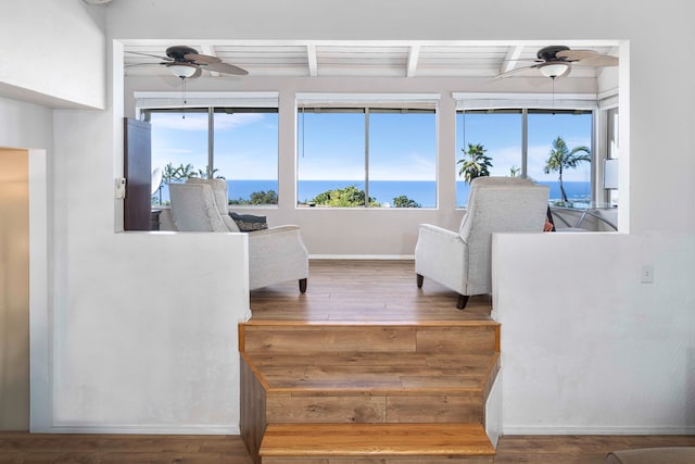 interior space featuring hardwood / wood-style flooring, beam ceiling, and wood ceiling