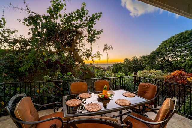 patio terrace at dusk with a balcony