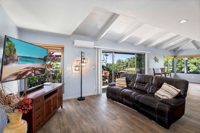 living room featuring a wall mounted air conditioner, lofted ceiling with beams, and a wealth of natural light