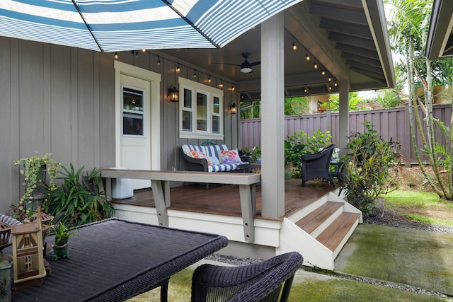 view of patio with ceiling fan and a wooden deck