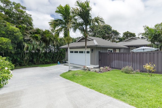 view of front facade featuring a front lawn and a garage