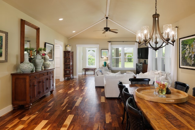 dining space featuring dark wood-type flooring and ceiling fan with notable chandelier