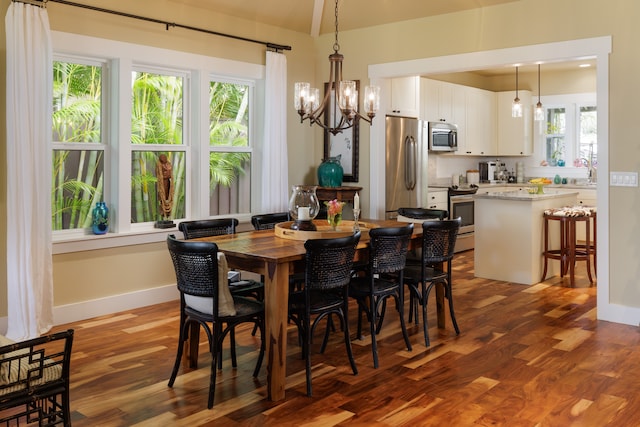 dining area featuring a chandelier, hardwood / wood-style floors, and plenty of natural light