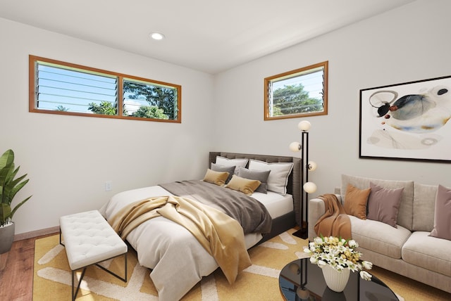 bedroom with hardwood / wood-style flooring