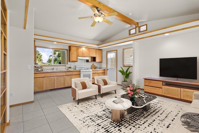 living room featuring lofted ceiling with beams, ceiling fan, light tile patterned floors, and sink