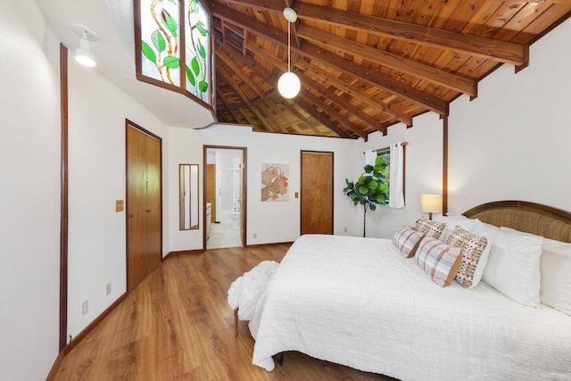 bedroom featuring light hardwood / wood-style flooring, wooden ceiling, high vaulted ceiling, connected bathroom, and beamed ceiling