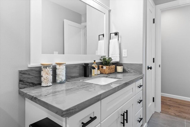 bathroom with hardwood / wood-style floors and vanity